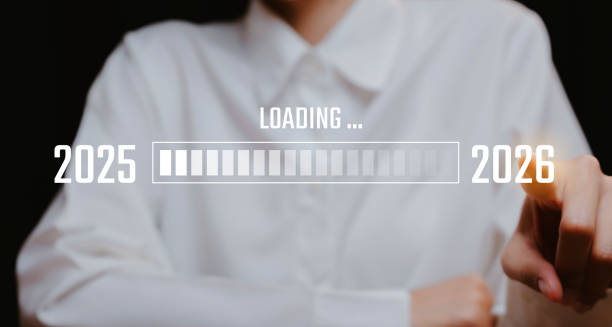 istock Woman's Hand on Progress Bar Transition from 2025 to 2026, Business concept. 2201975657
