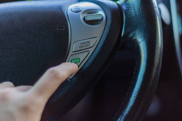 istock Setting eco mode on a modern car's steering wheel during a drive for better fuel efficiency 2201976447