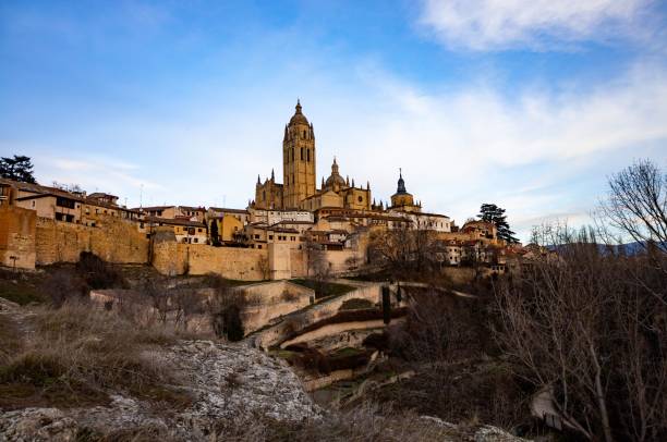 istock Segovia Cathedral and city walls under vibrant sky. 2201984775