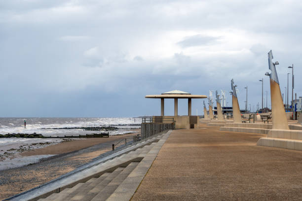 Seafront at Thornton Cleveleys showing the modern curved sea defenses with steps and concrete shelter