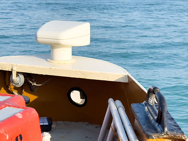 istock Boat bow with navigation equipment on calm blue sea 2201987597