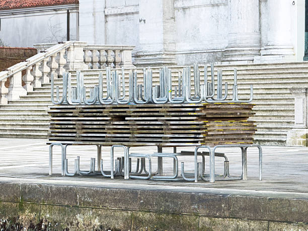 hundreds of vintage chairs stacked in a pile