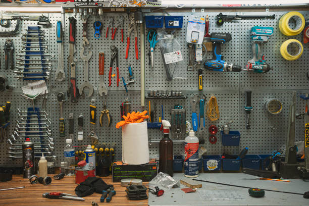 istock Bicycle Repair Shop. Man Customizing Racing Bike 2201989971