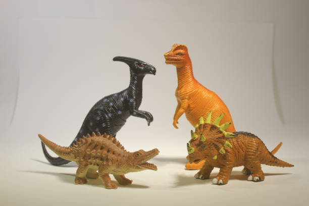 istock Colorful Dinosaur Toy Figures on White Background 2201993070