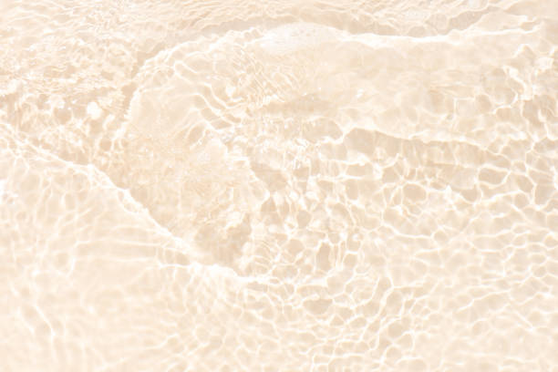 istock Blue water with ripples on the surface. Defocus blurred transparent blue colored clear calm water surface texture with splashes and bubbles. Water waves with shining pattern texture background. 2201994861