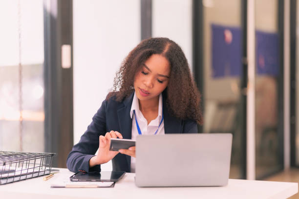 istock Successful businesswoman using laptop to work in office Internet technology company concept: Millennial female professional employee typing email on laptop at work. 2201997645