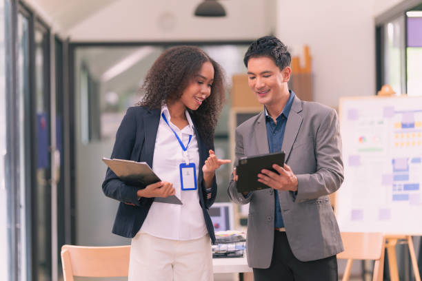istock Creative team discussing ideas in business meeting In a productive and multi-ethnic office worker environment, engage in strategic business marketing discussions. Habits 2201997657