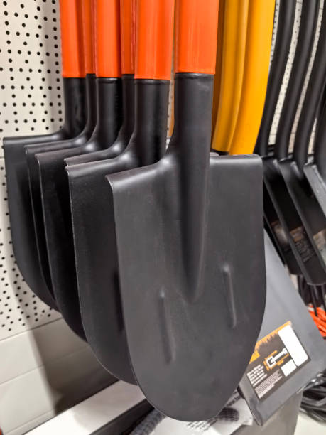 istock Shovels lined up for gardening and landscaping projects in a store 2201998903
