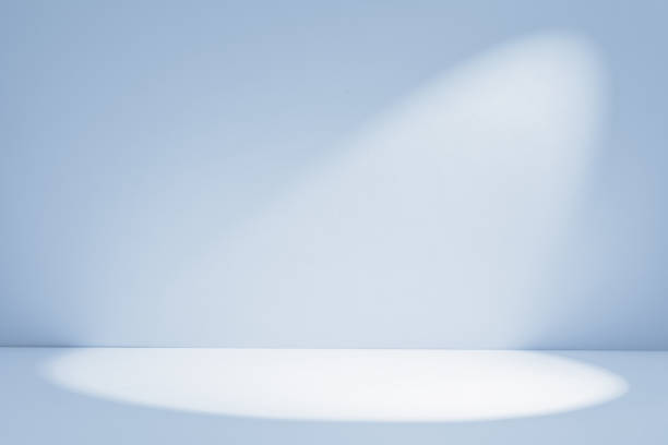 istock Background. Soft spotlight illuminating a blank stage, creating a serene atmosphere in a minimalist setting 2201999208