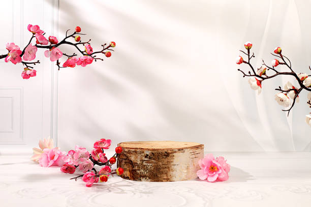 istock Abstract spring flower arrangement with cherry blossom branches and empty wooden podium,elegant beauty concept,stage for product display and business concept.Minimal modern aesthetics 2201999905
