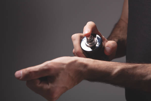 hand with bottle of perfume