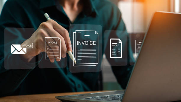 istock E-Invoice and Digital billing concept, Businessman using laptop to manage electronic statements on virtual screen. E-tax, Digital receipt, Online invoice processing and tax accounting solutions. 2202003566