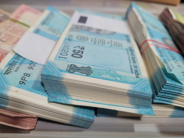 istock Closeup of various Indian Rupee currency notes showing detailed designs and features 2202004464