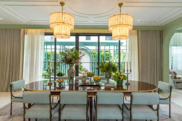 istock Grand dining room in nicely decorated house for 10 seaters. 2202005419