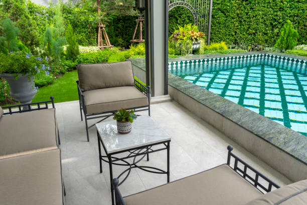 istock Backyard home patio and swimming pool for leisure lifestyle. 2202005425