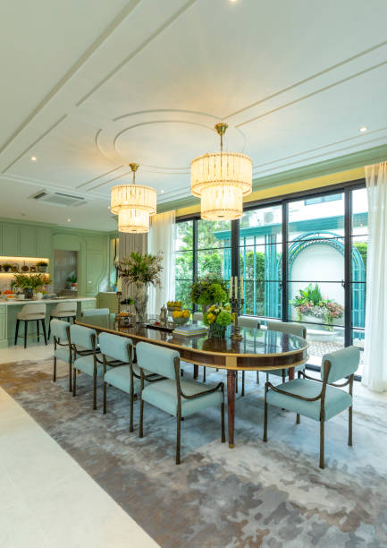 istock Grand dining room in nicely decorated house for 10 seaters. 2202005426