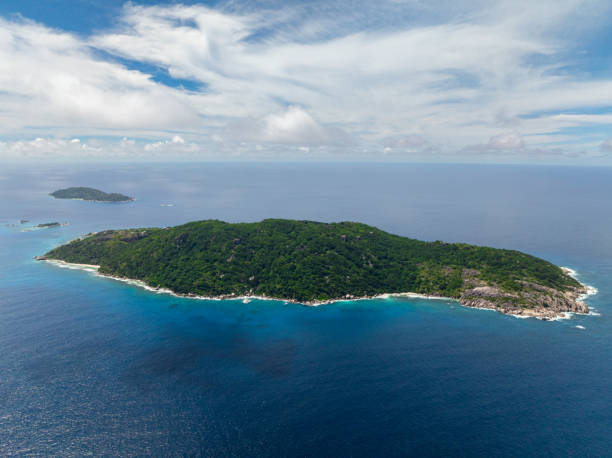 istock Island with green forest and rocky coastline. La Digue, Seychelles. 2202006010
