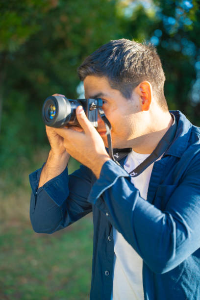 istock Professional Photographer Skillfully Capturing Beautiful Moments in Nature and Beyond 2202006536
