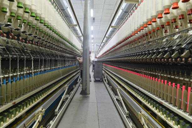 istock Cotton textile factory equipment is in operation 2202012071