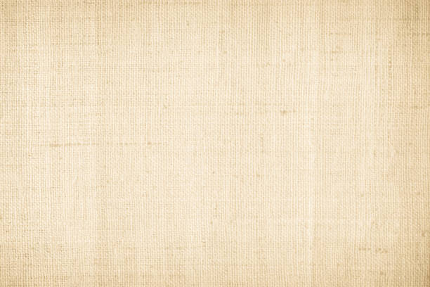 istock Brown sackcloth woven texture background in natural pattern. Jute hessian burlap, linen background in light beige cream color blank. Weaving canvas fiber line cotton cloth textured as organic. 2202013925