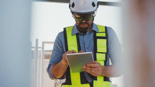 istock Maintenance engineer inspect the electrical control board MDB of solar farm. 2202015940