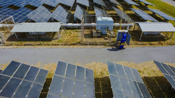 istock Aerial view of engineers working on a solar farm. 2202016047
