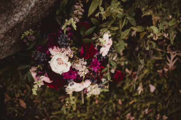 istock Bridal wedding bouquet from above with dark colors 2202017354
