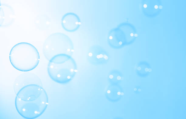 Beautiful Transparent Soap Bubbles Floating in The Air. Celebration Festive Backdrop. Freshness Soap Suds Bubbles Water. Abstract Blue Textured Background.