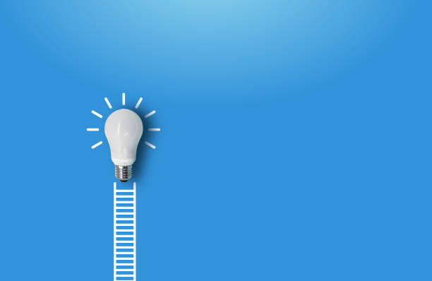istock white ladder and a white lightbulb leaning against a blue wall. 2202023047