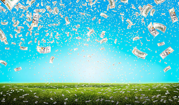 istock Falling large group of money over white background 2202023483
