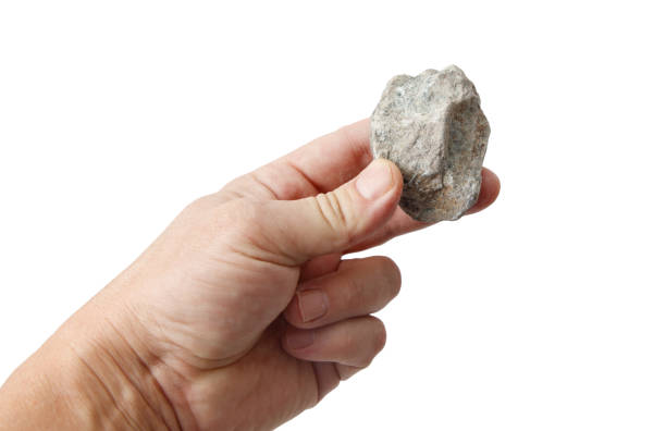 istock Jadeite stone in hand isolated on white background 2202023567