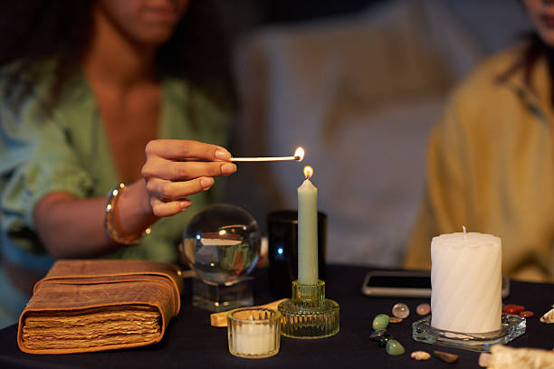 istock Unrecognizable Girl Lighting Up Candle 2202024423