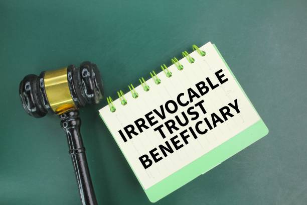istock judge's gavel and notebook with the words Irrevocable trust beneficiary 2202025271