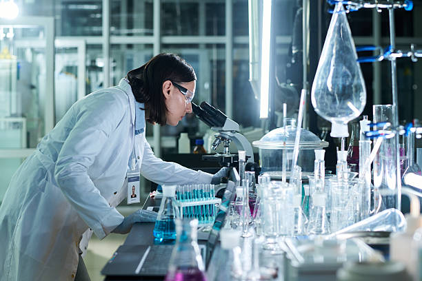 istock Young Woman Working In Lab At Night 2202025659