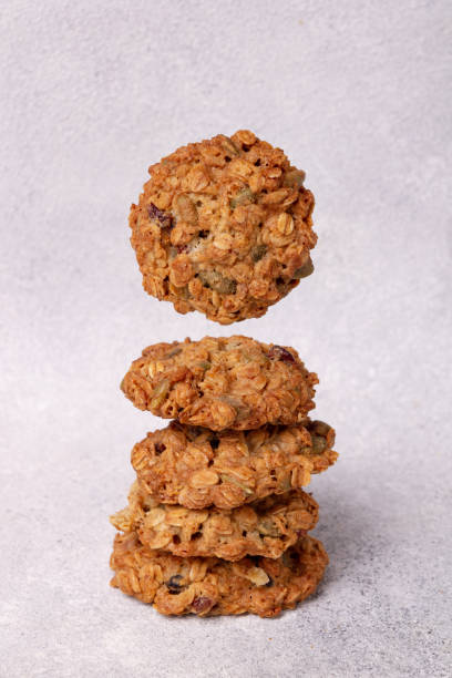 istock stack of oatmeal cookies with seeds, on white textured background 2202026702