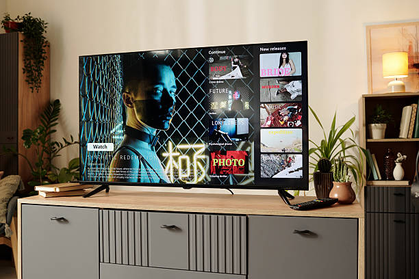 istock Watching Movie on Modern Living Room Television Screen 2202029310