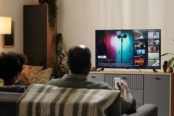 istock Watching TV Show in Cozy Living Room Setting 2202029403