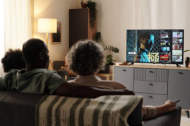istock Watching Television in Cozy Living Room Setting 2202029446