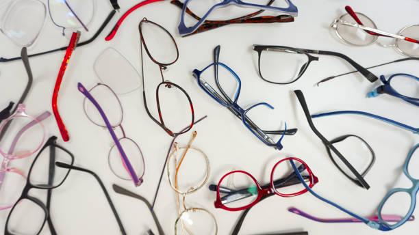 istock Assortment of broken optical eyeglasses, broken hinges, missing lenses 2202029527