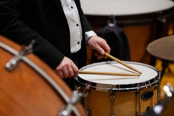 istock A musician playing the drums in an orchestra 2202029756