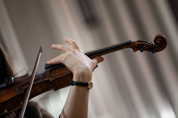 istock Violin in the hands of a musician 2202029774