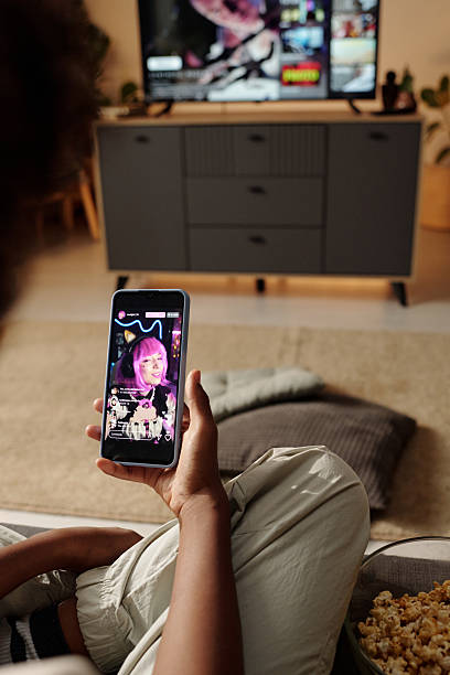istock Watching TV and Using Smartphone in Comfortable Living Room 2202030455