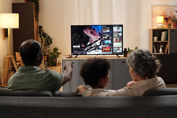 istock Watching Television Together in a Cozy Living Room 2202030528