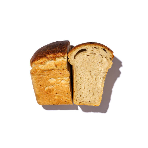 istock A loaf of bread with two slices cut on a white background 2202032396
