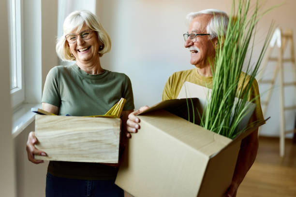istock Happy senior couple moving into a new home. 2202034092