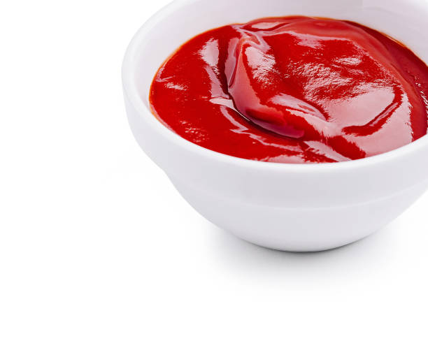 istock Fresh red ketchup in a white bowl ready for serving at a casual meal setting 2202034433