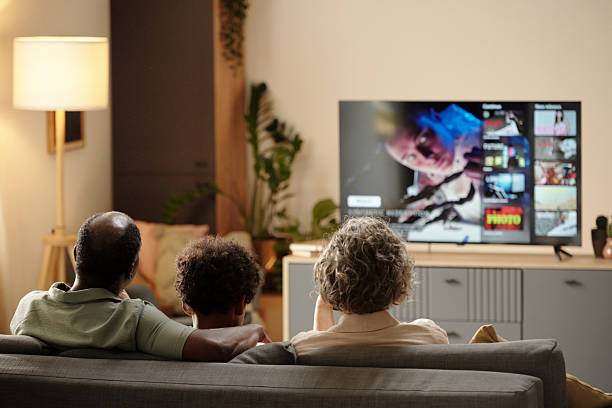 istock Watching a Movie Together in Living Room Setting 2202036607