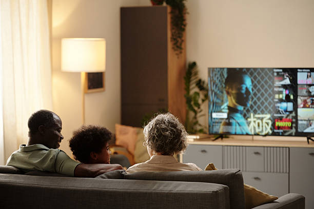 istock Watching Television Together in Modern Living Room 2202036658