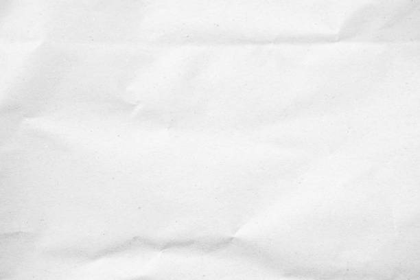 istock White recycled craft paper texture as background. Grey paper texture, Old vintage page or grunge vignette of old newspaper. Pattern rough art creased grunge letter. Hardboard with copy space for text. 2202037116