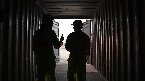 istock Engineers and technicians inspect the inside of containers and order repairs at the container manufacturing and storage site 2202040634